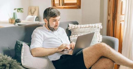 A small business owner on a laptop at home using Splashtop to work remotely