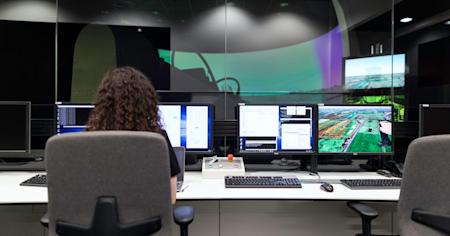 A person working on a computer at a desk.