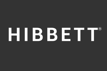 White, bold, capitalized text that reads HIBBETT on a dark gray background.