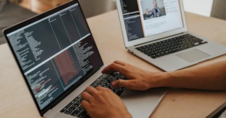 A person typing on a laptop.
