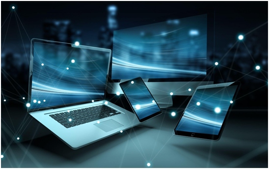 Photo of several laptops, phones, and tablets