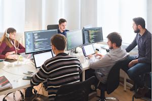 IT team managing patch and vulnerability workflows in an office.
