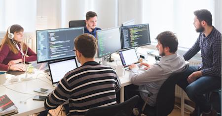 IT team managing patch and vulnerability workflows in an office.