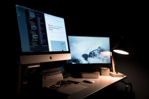 A desktop computer and monitor sitting on a desk.