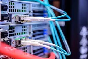 A server with wires plugged into it.
