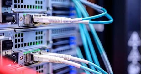 A server with wires plugged into it.