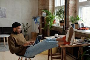A man working remotely from his home.