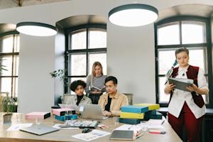 People working on computers in a small business office.