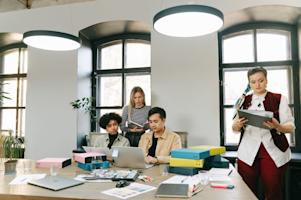 People working on computers in a small business office.