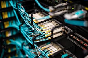 A server with several wires plugged into it.