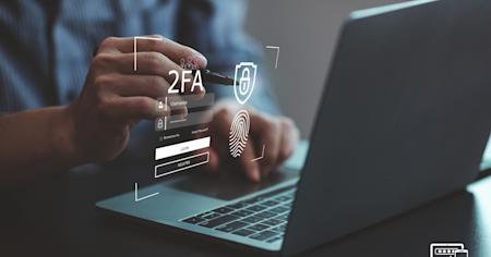 An employee using multi-factor-authentication (MFA) to access his computer.