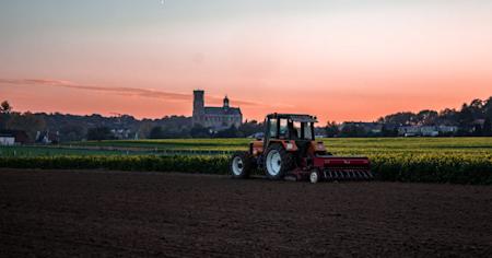 A tractor working on a farm.