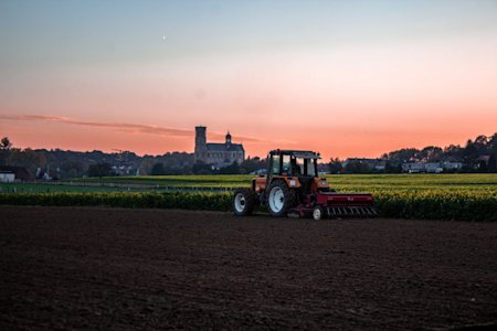 A tractor working on a farm.