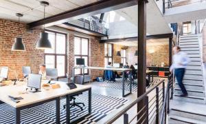 An office with several desks and computers.