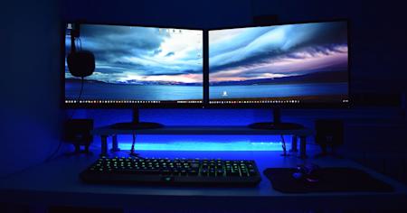 A computer with dual monitors on a desk.