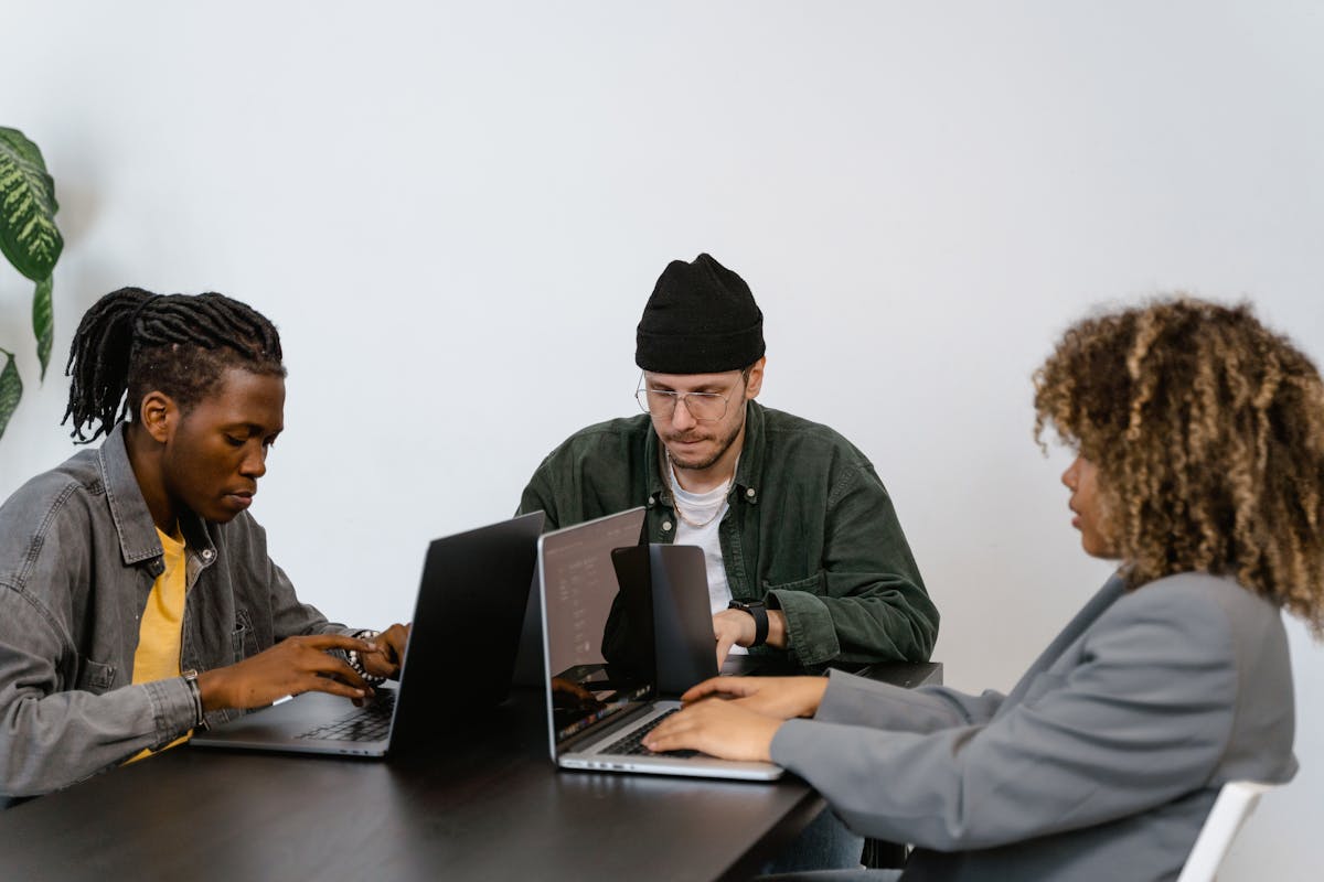 A small IT team working in an office.