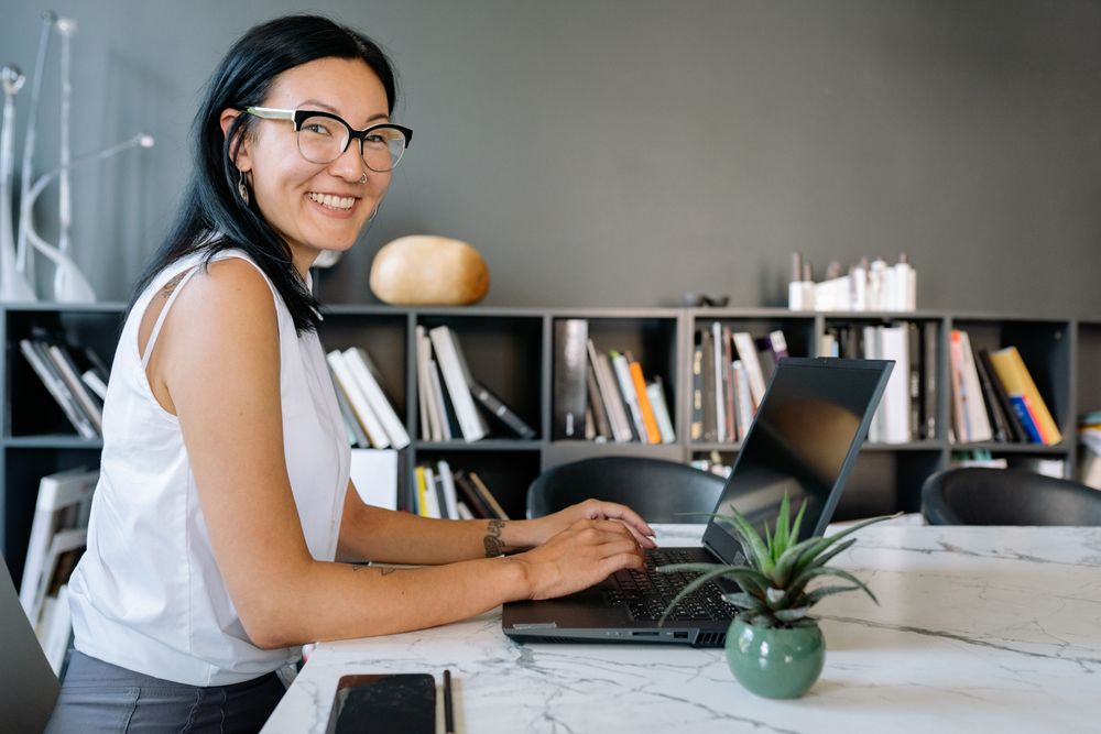An IT admin working on a computer in an office.