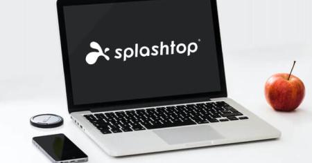 Laptop With Splashtop Logo, Phone, And Smartwatch On Desk