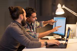 Two members of an internal IT team using Splashtop's remote access tools.