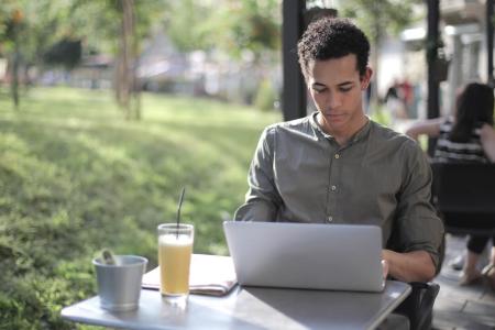 A man using a laptop with Splashtop to replace TeamViewer