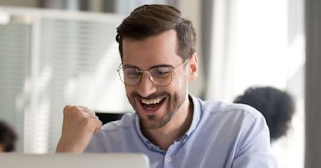 Man looking excited while reading about opportunities for MSPs