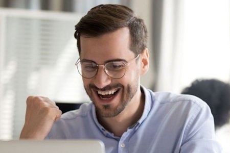 Man looking excited while reading about opportunities for MSPs