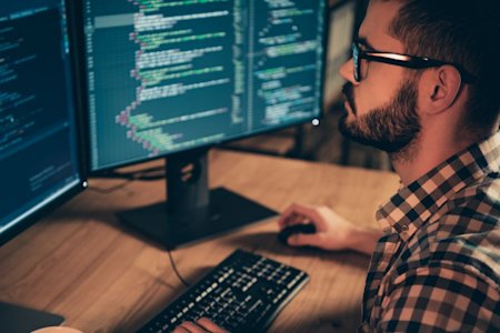 Man using Splashtop remote desktop application on his laptop to access a Linux machine while working