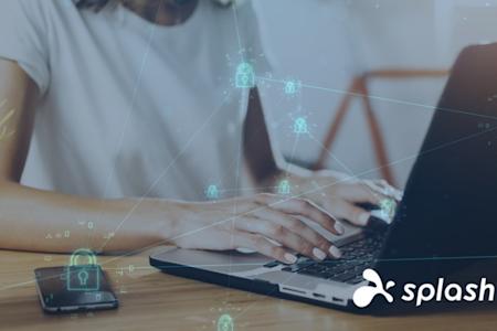 A person types on a laptop at a desk with a smartphone nearby. Digital security padlock icons and network lines are superimposed. The Splashtop logo appears in the lower right corner.