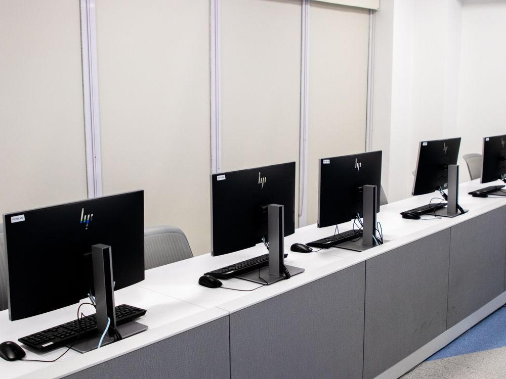 A row of computers in a computer lab.