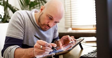 Man using a Wacom tablet connected to a computer via Splashtop remote desktop