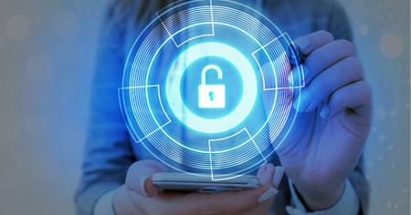 Person holding a mobile phone with a circular lock security image projected above it