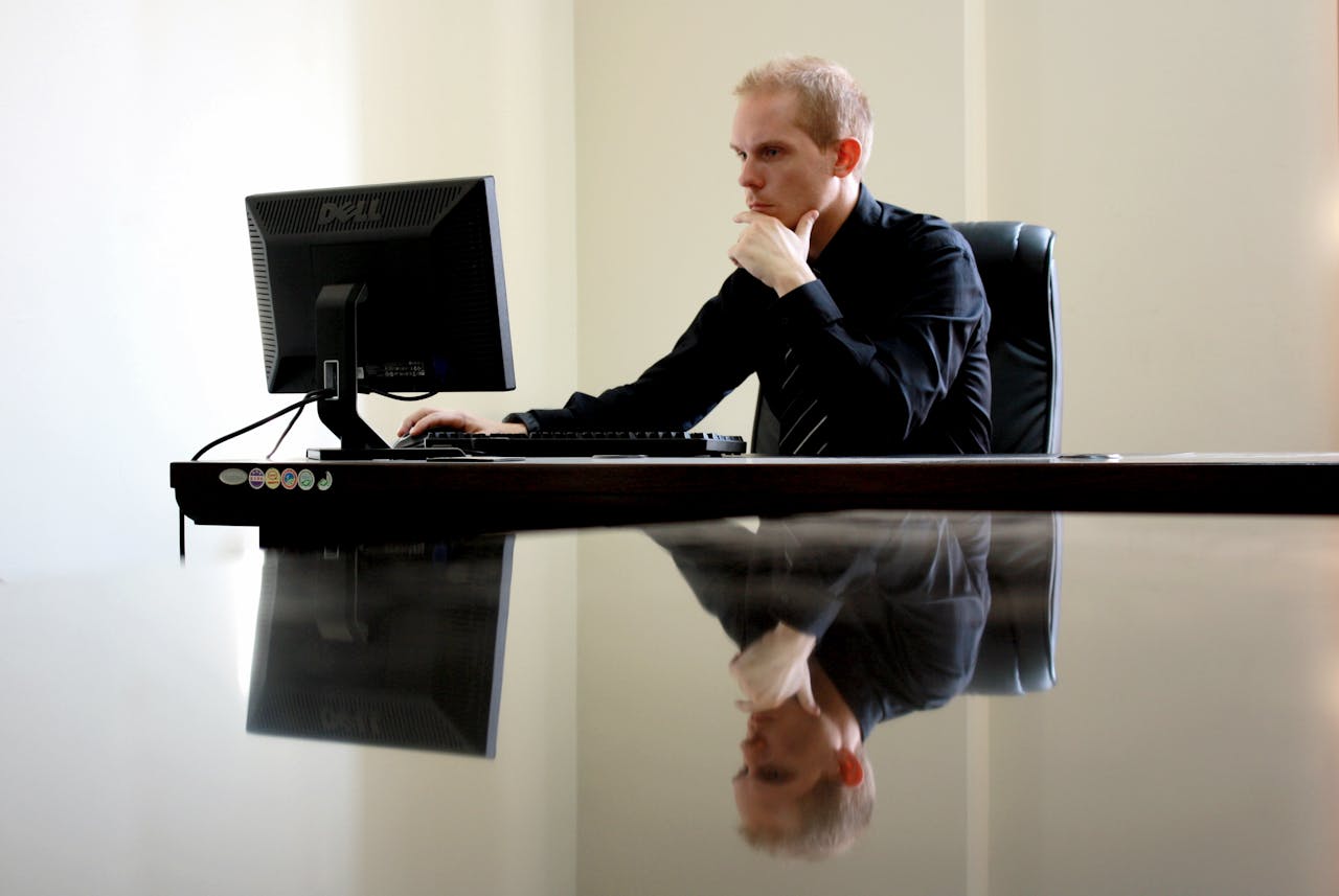 A business professional working on a Windows computer.