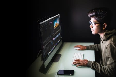 Student using Splashtop to connect to their school computer late at night to edit a video project