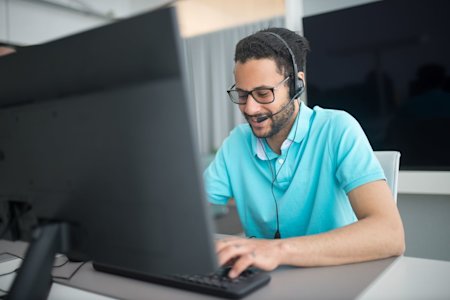 An MSP technician working at their computer.