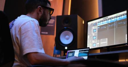 A man working remotely using Splashtop on an audio production project