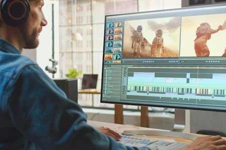 A person using Splashtop to remotely access another desktop to use video editing software.