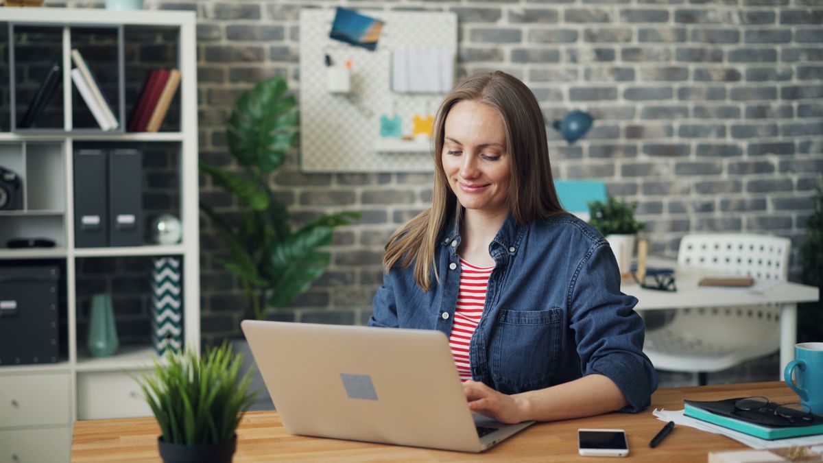 A woman using her laptop.