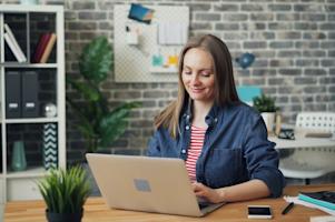 A woman using her laptop.