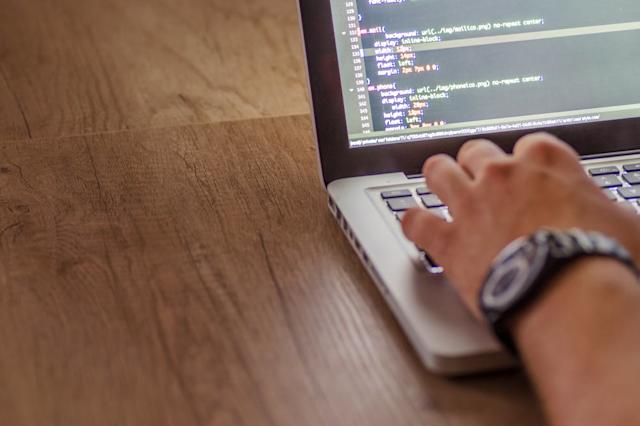 A person typing on a computer.