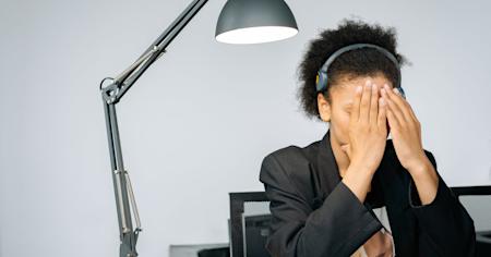 An IT technician working at their desk.