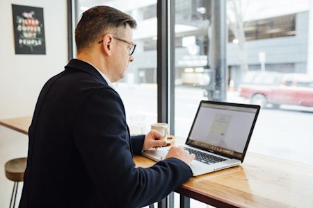 A man working on a laptop.