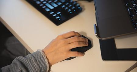 A person working at their workstation.