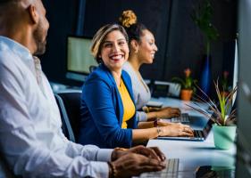 Happy computer users in an office