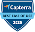 A blue shield-shaped badge with the Capterra logo at the top, text reading Best Ease of Use in the center on a light blue banner, and 2025 at the bottom.