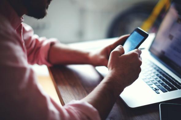 A person using an Android phone to access a device