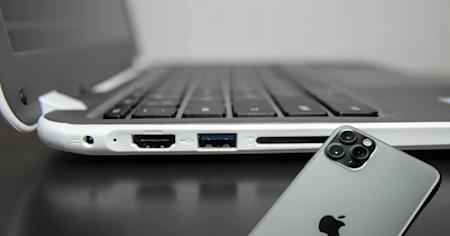 A chromebook and an iPhone, connected via remote access software.