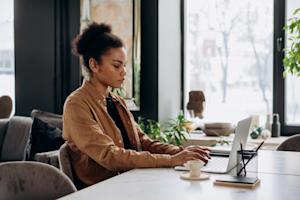 A woman using her laptop.