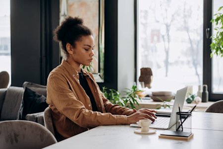 A woman using her laptop.
