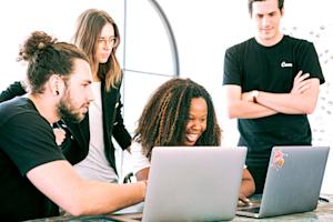 A group of workers using computers.