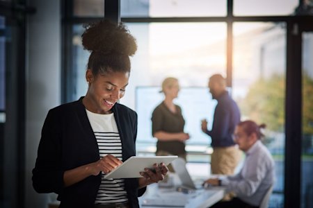 Four busy employees using Splashtop's remote access software to be more productive.